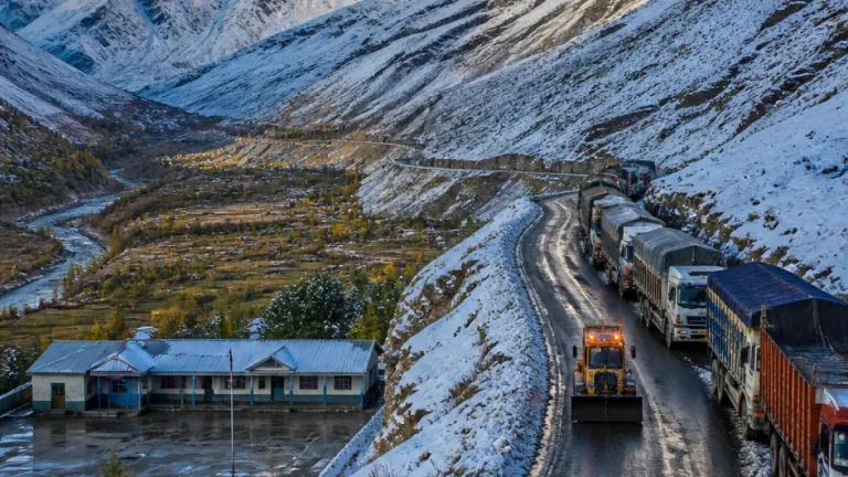 Fresh snowfall in Kargil disrupts NH‑1D traffic; schools reopen as rain aids farmers