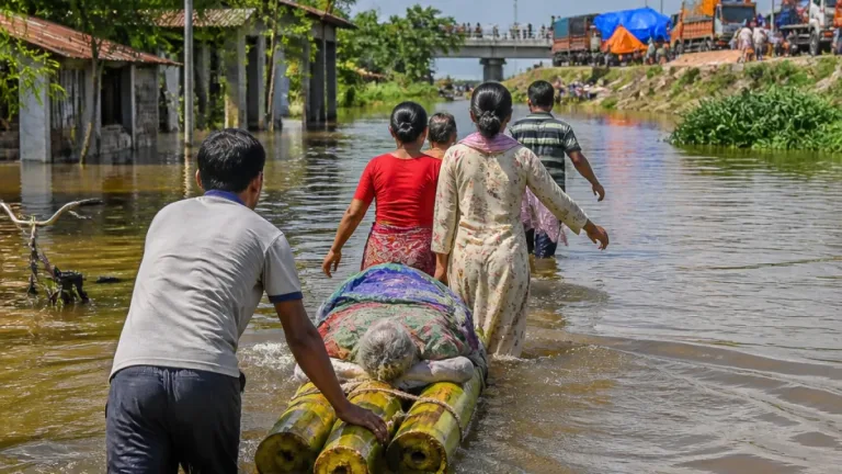 Ninety-seven-year-old rescued on banana-raft as Assam floods swamp non-flood zones