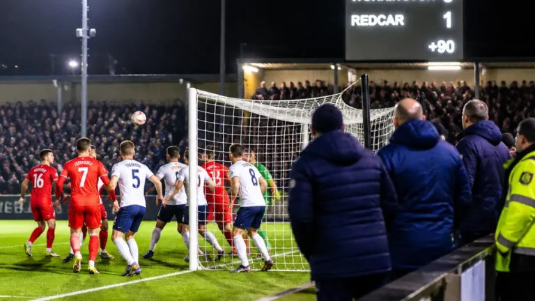 Redcar snatch late winner at Workington after hosts reduced to ten men