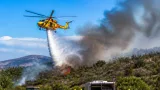 Carbonia, fiamme nell'agro: elicottero del Corpo Forestale impegnato su Campu Frassolis