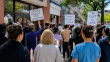 Dozens rally in St. Albans for detained Ugandan asylum seeker who worked at UVM Medical Center