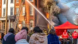 Woman injured after jumping from third floor as three-alarm fire rips through Elizabeth multi-family home
