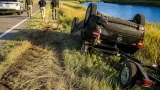 Woman killed after vehicle pulling boat fishtails and rolls on Rendezvous Road