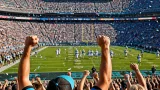 WVU pulls away in second half, tops Virginia 38-27 in Charlotte