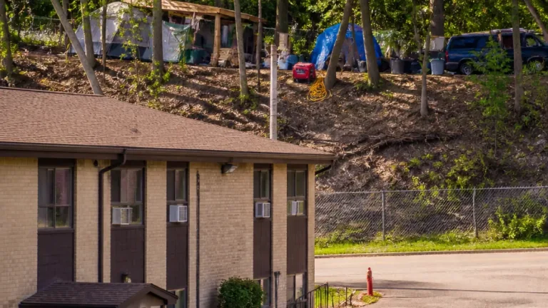St. Paul residents raise alarm as Mississippi River bluff encampment grows behind Waterford Bay